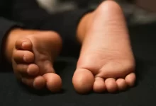 persons feet on black textile