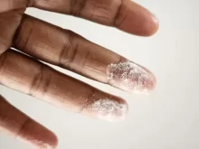 close-up photo of person's finger with white powder