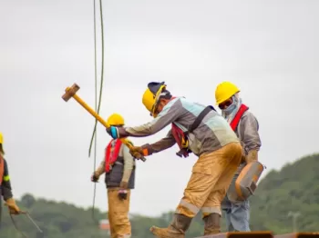 construction worker men holding hammer