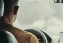 man driving vehicle