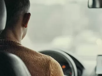 man driving vehicle