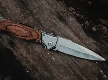 brown handle silver knife on brown wooden table