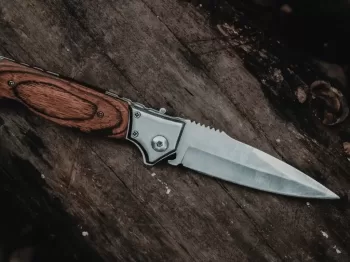 brown handle silver knife on brown wooden table