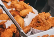 fried chicken on brown paper bag