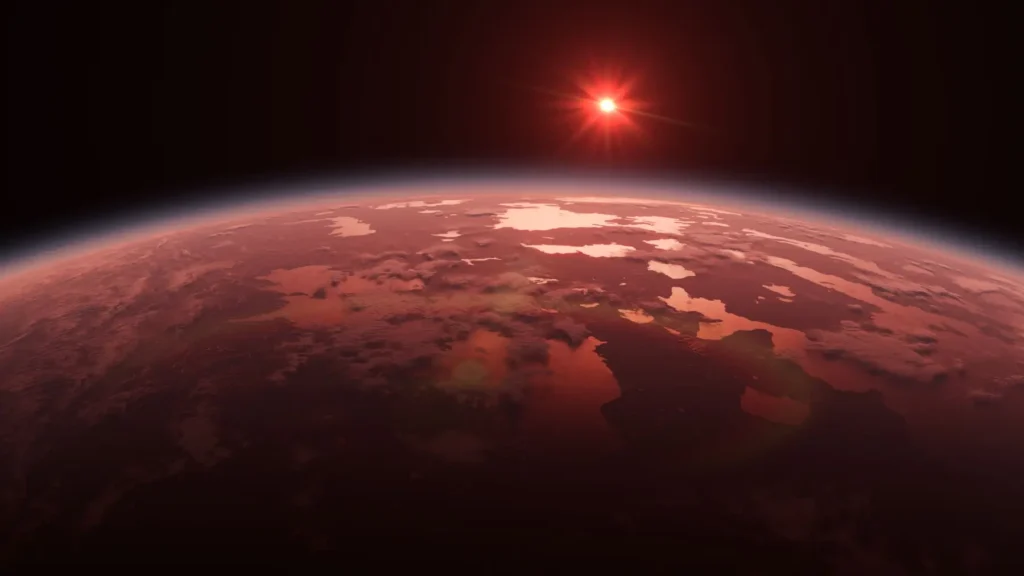 Pohled na rudý povrch exoplanety TRAPPIST 1e se sluncem na horizontu
